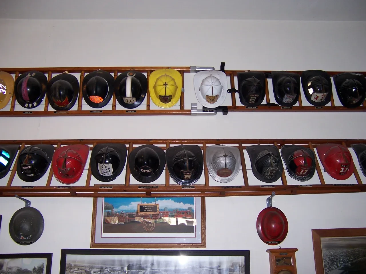 Rows of historic firefighter helmets mounted on display racks